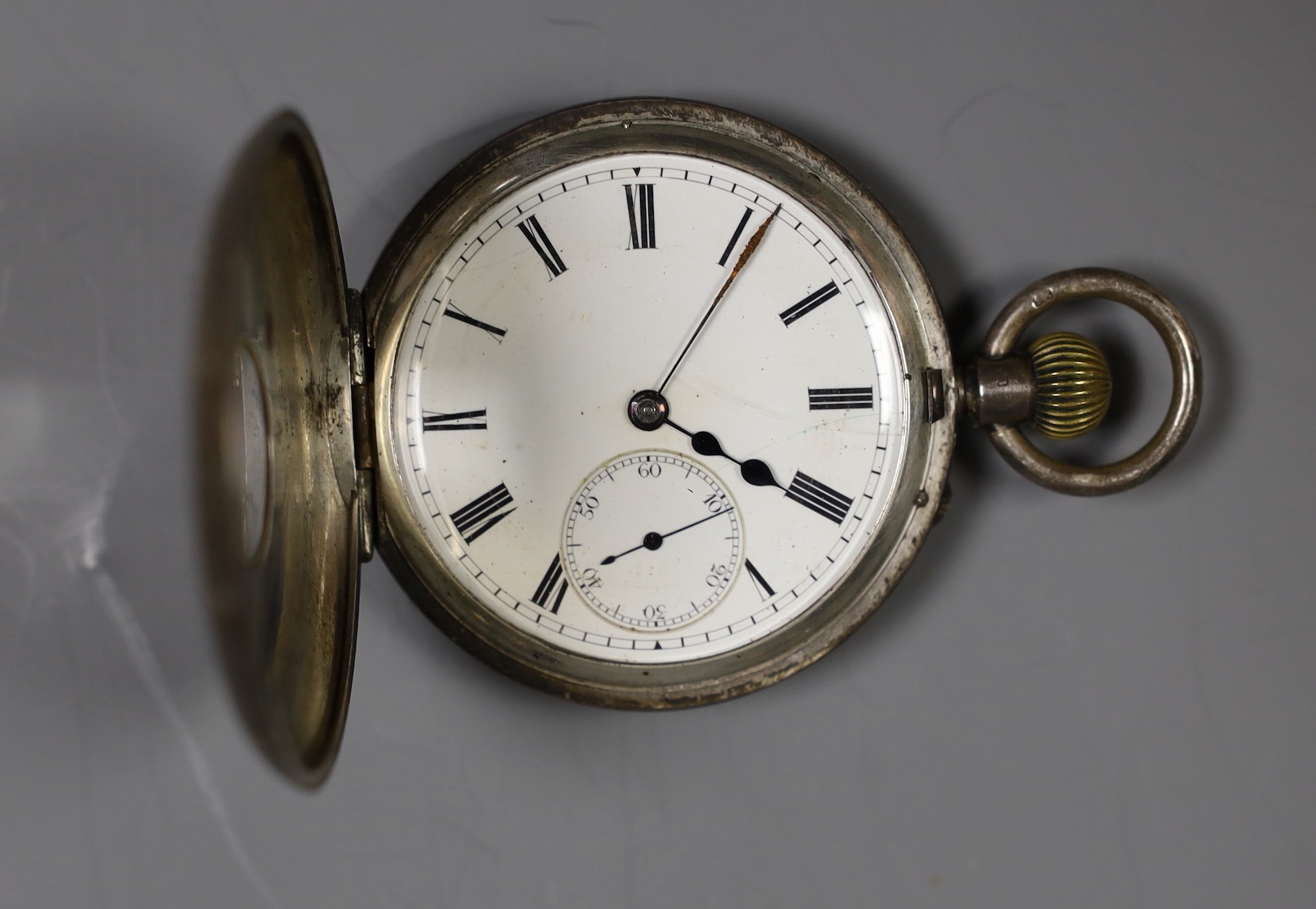 Two silver pocket watches including half hunter and one other white metal open faced pocket watch(lacking glass).